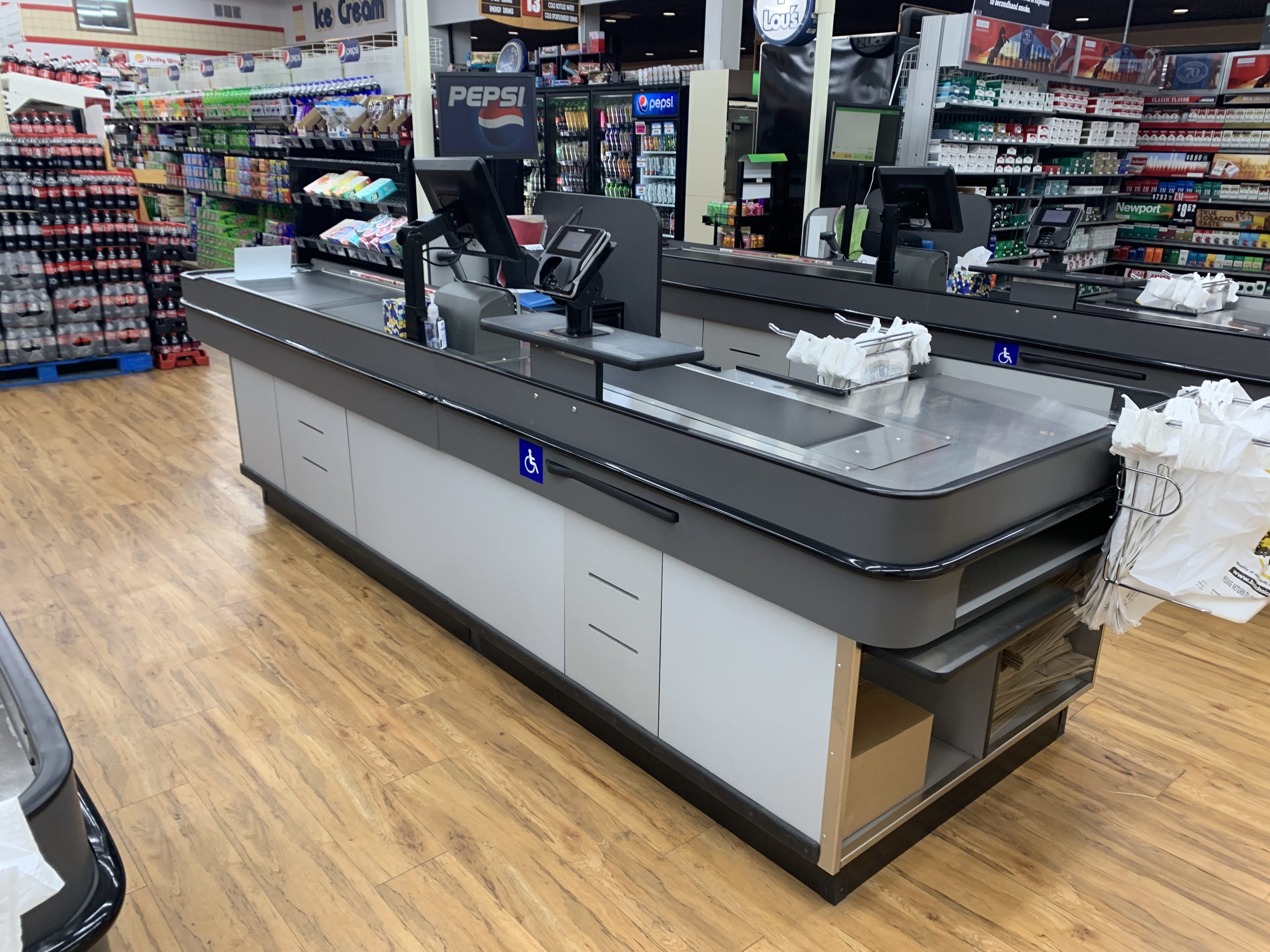 Custom retail checklane system manufactured by KPI Concepts
