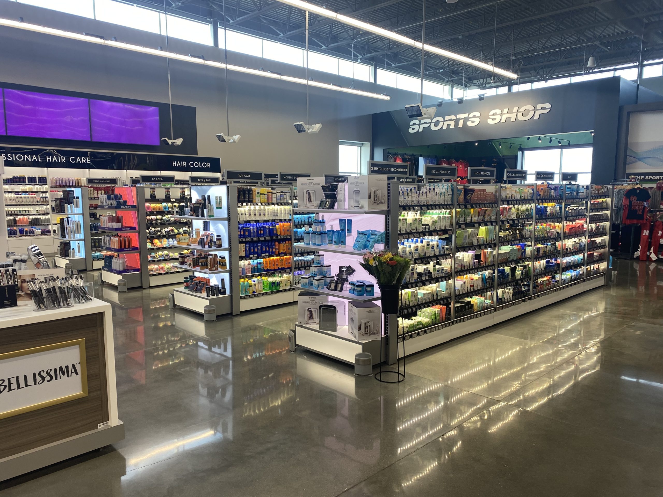 Finished retail store rollout with shelving and fixtures by KPI Concepts